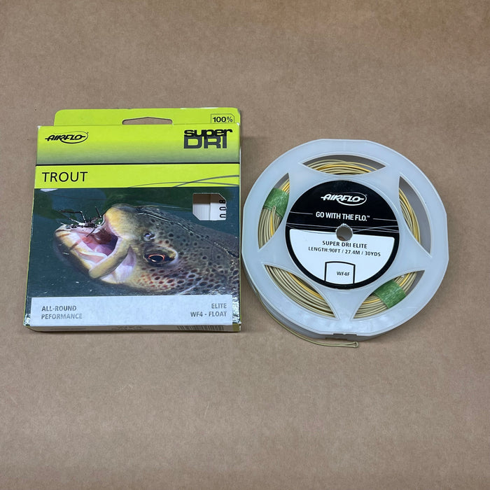 Airflo trout fishing line packaging and reel on a brown background