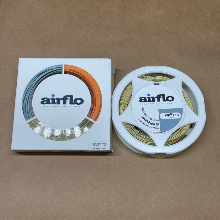 Airflo fishing line spool and packaging on a brown background